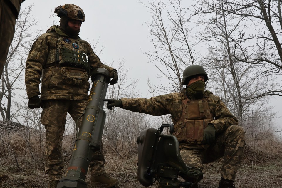 Ukrainian soldiers prepare a MILAN anti-tank missile system.