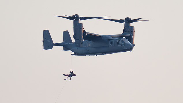 RAF fighter jets scrambled to intercept a Venezuelan oil tanker in the Atlantic yesterday as the US plotted a dramatic mission to seize it. Pictured: A CV-22B Osprey was seen practicing winching exercises off the coast of Felixstowe