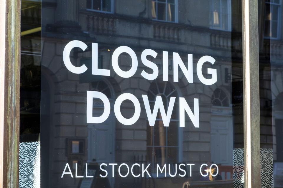 The Bank of England headquarters with the Union Jack flag flying, symbolizing the UK economy and monetary policy.