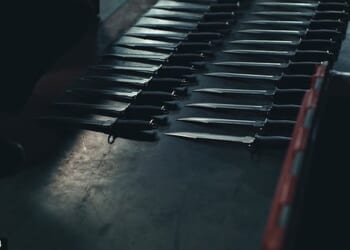 Rows of zombie knives seized by police were laid out on the 24 Hours In Police Custody Investigates: Zombie Knives on Channel 4