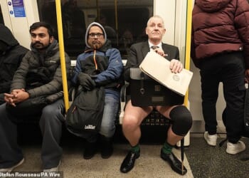 A man takes part in the annual No Trousers Tube Ride on the London Underground yesterday