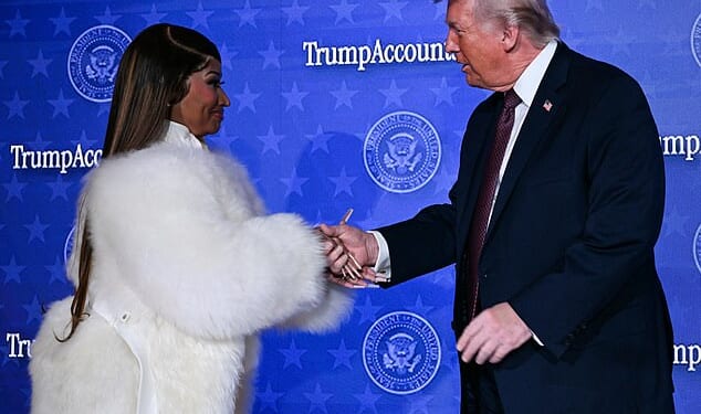 President Donald Trump and rapper Nicki Minaj embraced hands when she came on stage for quick remarks at a Trump Accounts event