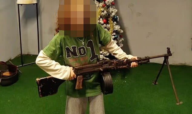 A young child is seen holding a gun during a lesson with Hope Sussex