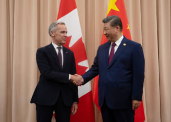 Canadian Prime Minister Mark Carney, left, greets Chinese President Xi Jinping in South Korea in a file photo from October.