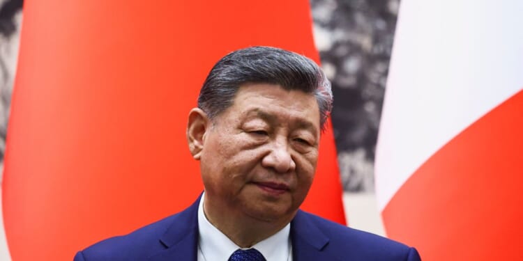 Chinese President Xi Jinping attends a signing ceremony for agreements at the Great Hall of the People in Beijing on Dec. 4, 2025.