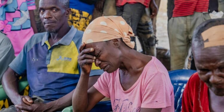 Survivors of Sunday's attack in Kurmin Wali, northwest Nigeria, react during a meeting with Kaduna state Governor Uba Sani Wednesday.