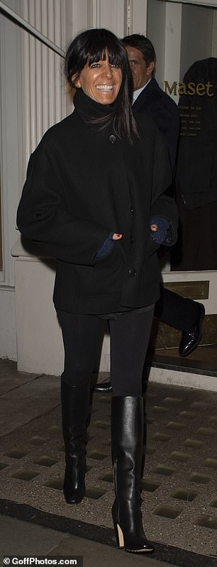 She added inches to her frame with black leather knee-high boots, accessorising her look with statement blue fingerless gloves