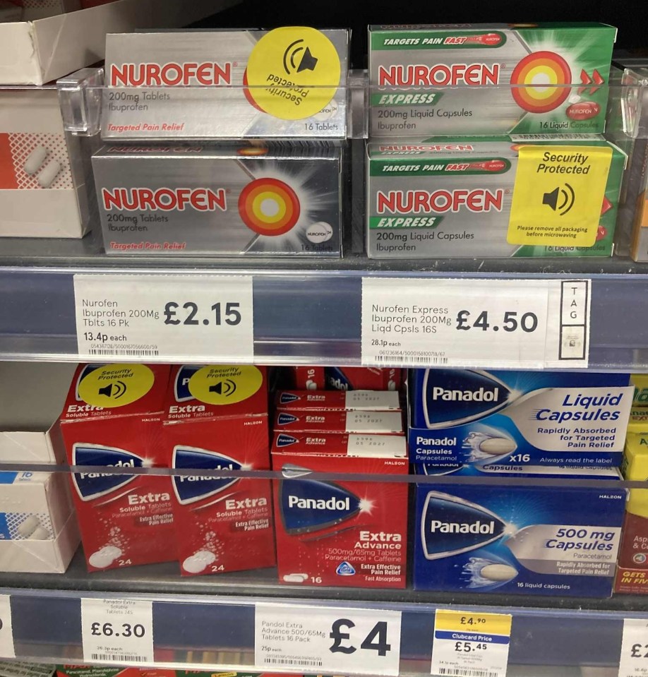 Cold and flu remedies in a supermarket aisle, with boxes of Nurofen, Nurofen Express, Panadol, and Panadol Extra, some of which have security tags.