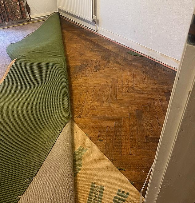 Laura and Aaron found gorgeous solid oak flooring they found hidden beneath the carpet (pictured)