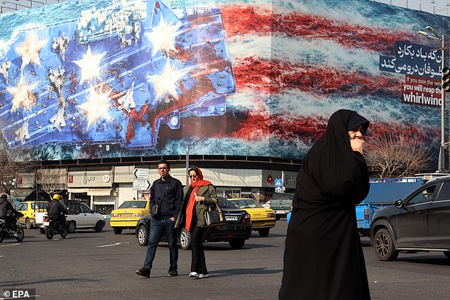 A huge anti-US billboard hangs in a public square in Tehran