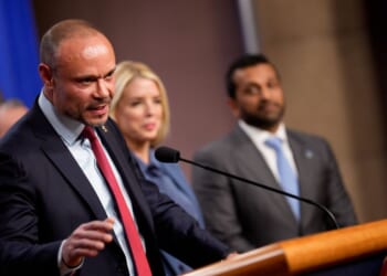 FBI Deputy Director Dan Bongino, accompanied by Attorney General Pam Bondi and FBI Director Kash Patel, speaks during a news conference on an arrest of a suspect in the pipe bomb case at the Department of Justice on Dec. 4, 2025, in Washington, D.C.