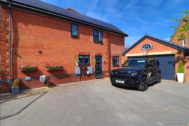 Outside, the home is built for entertaining, featuring artificial lawns, resin patios, raised beds, a bar area and a hot tub beneath a pergola