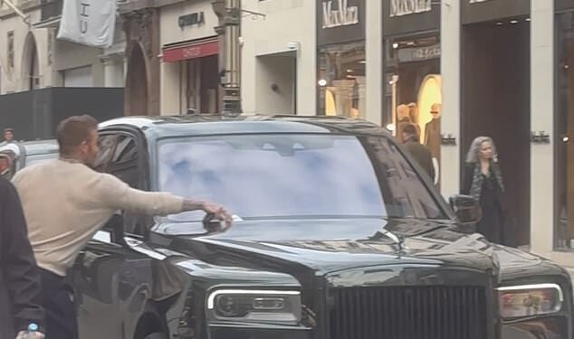 David Beckham ripped a parking ticket off the windscreen of his swanky Bentley after a shopping spree at Rolex on Bond Street with wife Victoria on Sunday