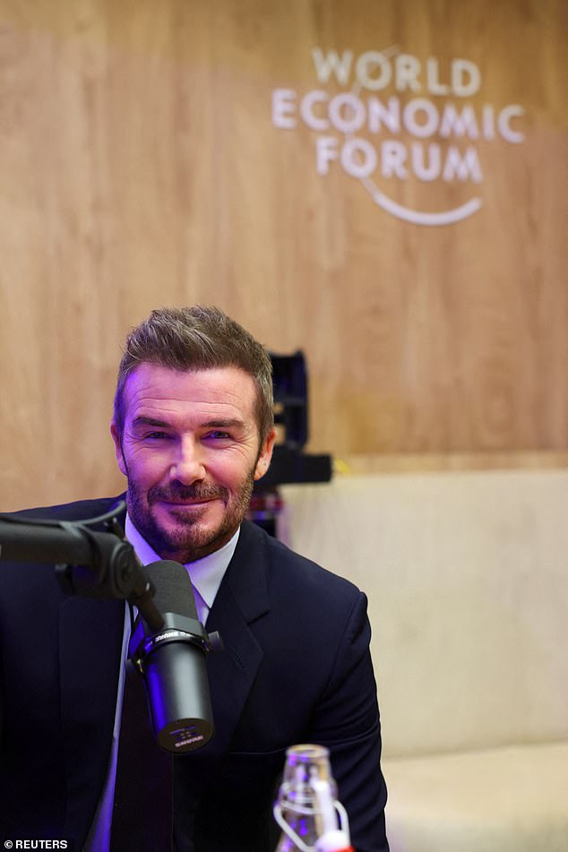 David Beckham struggled to smile as he was pictured for the first time since son Brooklyn's explosive statement about their family feud on Tuesday as he appeared at the World Economic Forum in Davos