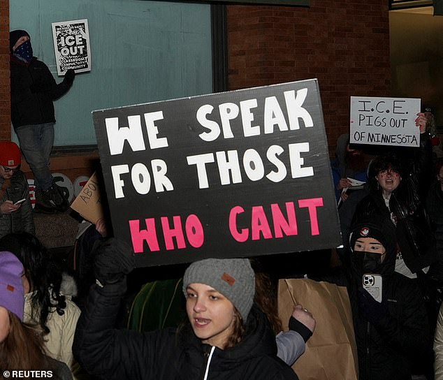 Other signs at the protest read 'We speak for those who can't'