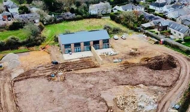 Locals have accused a wealthy developer of causing a planning 'apocalypse' after converting a barn into newbuild homes worth more than £1million