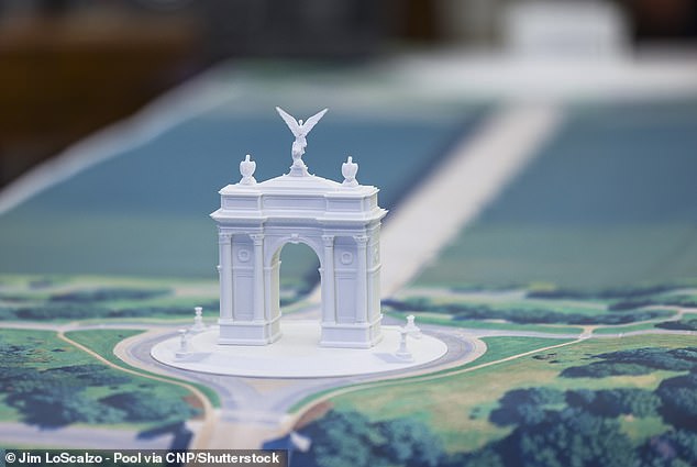 A model of the 'Triumphal Arch,' which has also been nicknamed the 'Arc de Trump' was captured sitting on the Resolute Desk of the Oval Office in October