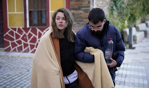 Ana Garcia Aranda, pictured on Monday, made a desperate plea for help to find her dog who vanished during Sunday's train crash - which left her hurt