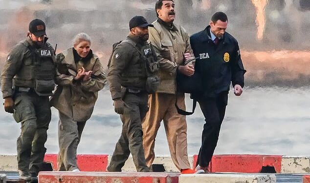 Cilia Flores pictured, second left, arriving with husband Nicolas Maduro, second right, as they are transported to appear in a New York court on Monday
