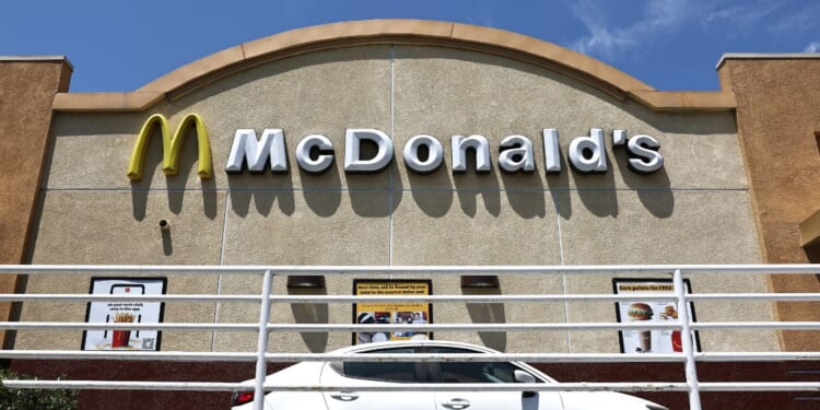 A customer waits in the drive thru lane at a McDonald's restaurant on July 22, 2024, in Burbank, California.