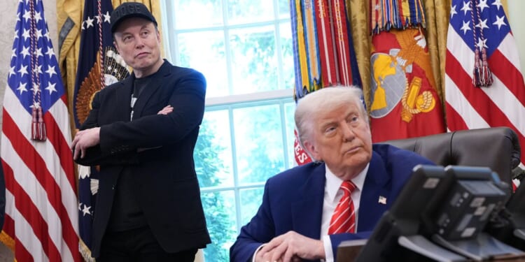 Tesla CEO Elon Musk and President Donald Trump listen to questions from reporters inside the Oval Office of the White House in Washington, DC on May 30, 2025.