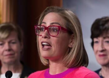 Now-former Sen. Kyrsten Sinema speaks to reporters following Senate passage of the Respect for Marriage Act at the U.S. Capitol in Washington, D.C., on Nov. 29, 2022.