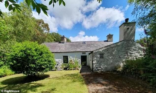 The isolated farmhouse, which is set up a long lane in the village of Y Ffor and three miles from the coastal town of Pwllheli in Gwynedd, north Wales, is up for sale for £618,000