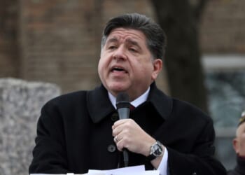 Illinois Gov. J.B. Pritzker delivers a short speech during a Veterans Day ceremony at Little Village's Manuel Perez Jr. Memorial Plaza on Nov. 11, 2025, in Chicago, Illinois.