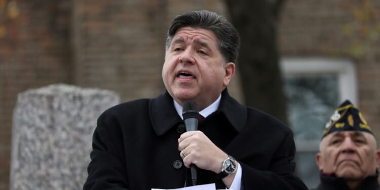Illinois Gov. J.B. Pritzker delivers a short speech during a Veterans Day ceremony at Little Village's Manuel Perez Jr. Memorial Plaza on Nov. 11, 2025, in Chicago, Illinois.