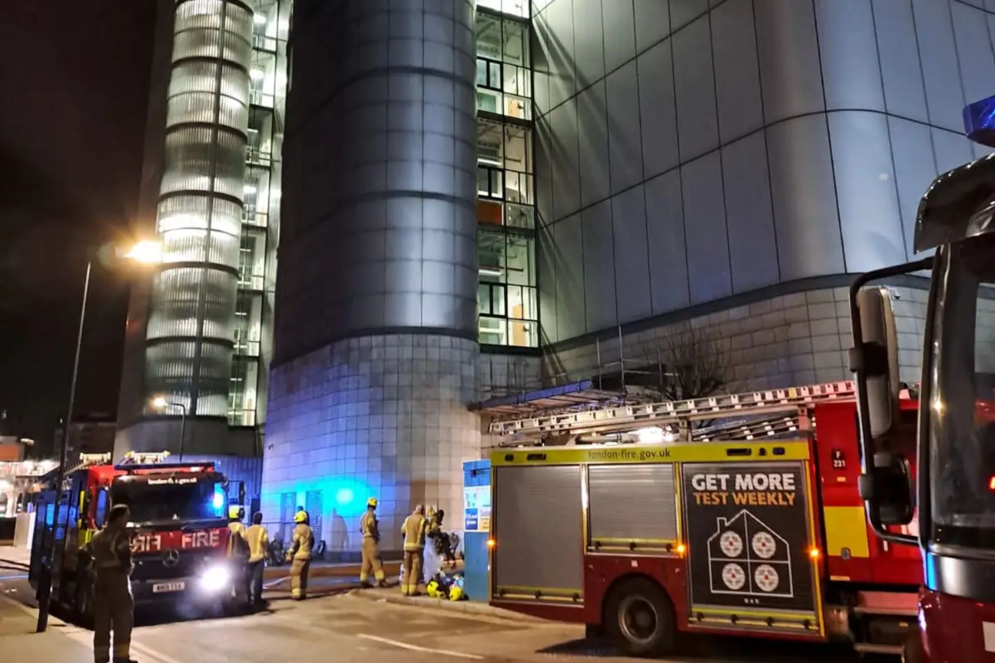 An image collage containing 1 images, Image 1 shows Firefighters and fire engines at a building at night