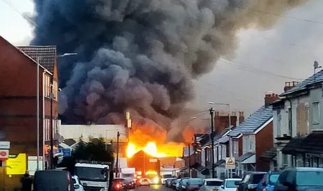 Towering plumes of thick black smoke and explosions have been reported after a blaze broke out at a factory in Wolverhampton, West Midlands, this morning