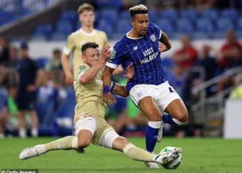 Swindon Town footballer, Ollie Clarke (left), pictured in the game against Cardiff in which the incidents took place last August. There is no suggestion Cardiff player Callum Robinson (right) was one of the opponents affected by Clarke's behaviour