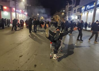 Anti-regime demonstrators celebrate as they take control of the streets in the city of Kermanshah, western Iran, this week as protests sweep the nation