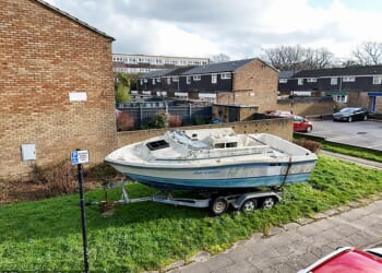 The abandoned boat has been left in a residential area - over a mile from the water - with no engine and a smashed roof since October