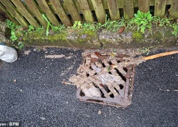 Soiled toilet roll and sewage left around one of the drains in Stithians after recent flooding