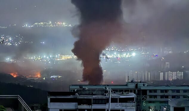 This grab taken on January 3, 2026, from UGC footage released by Jose Abreu in his X account @Jabreu89, shows smoke billowing over Caracas after a series of explosions part of a US military operation that led to the capture of Venezuelan President Nicolas Madruo