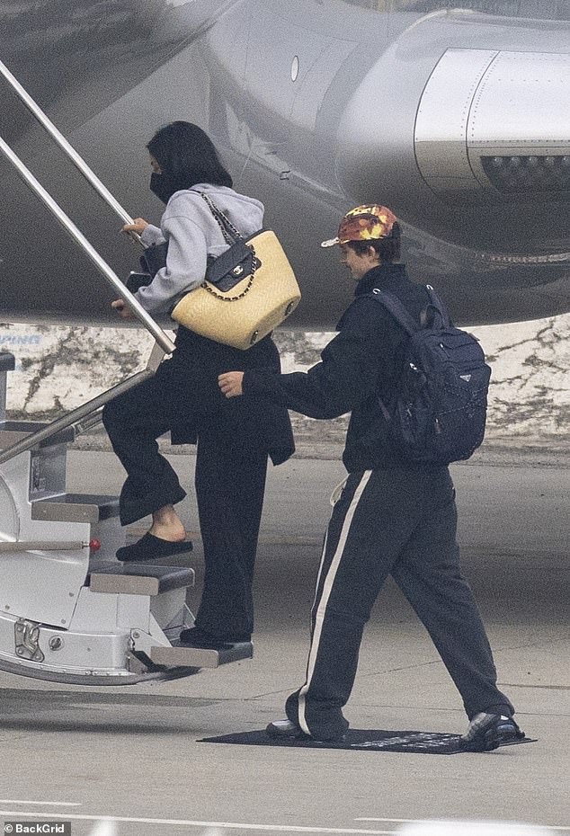 The loved-up couple appeared relaxed and giddy as they arrived at a private airport terminal, where they were seen boarding a sleek private jet together