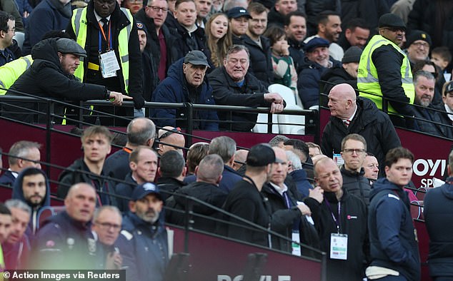 An alternate angle of the Sunderland bench with West Ham supporters behind it