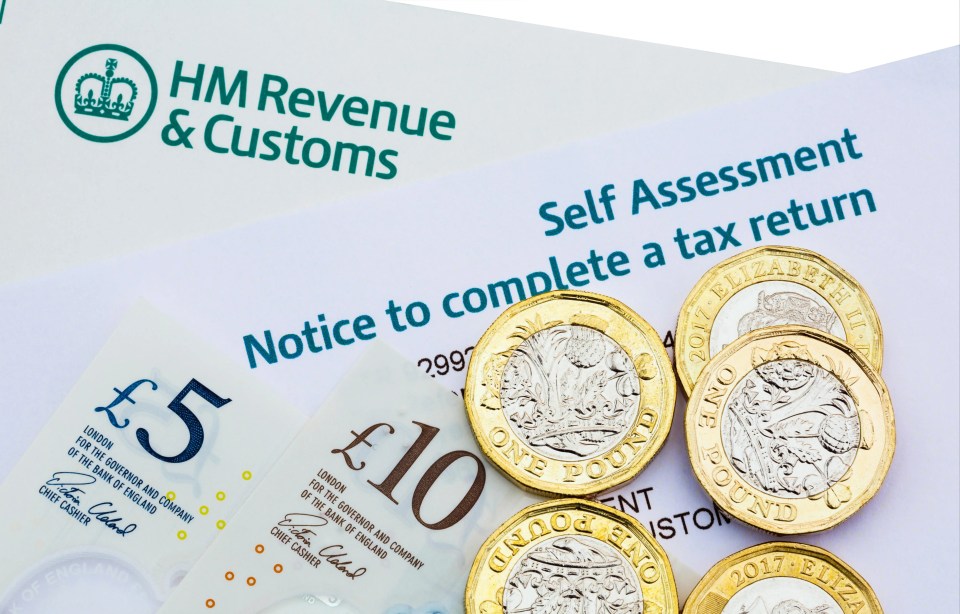 UK Self Assessment tax return notice with British pound notes and coins.