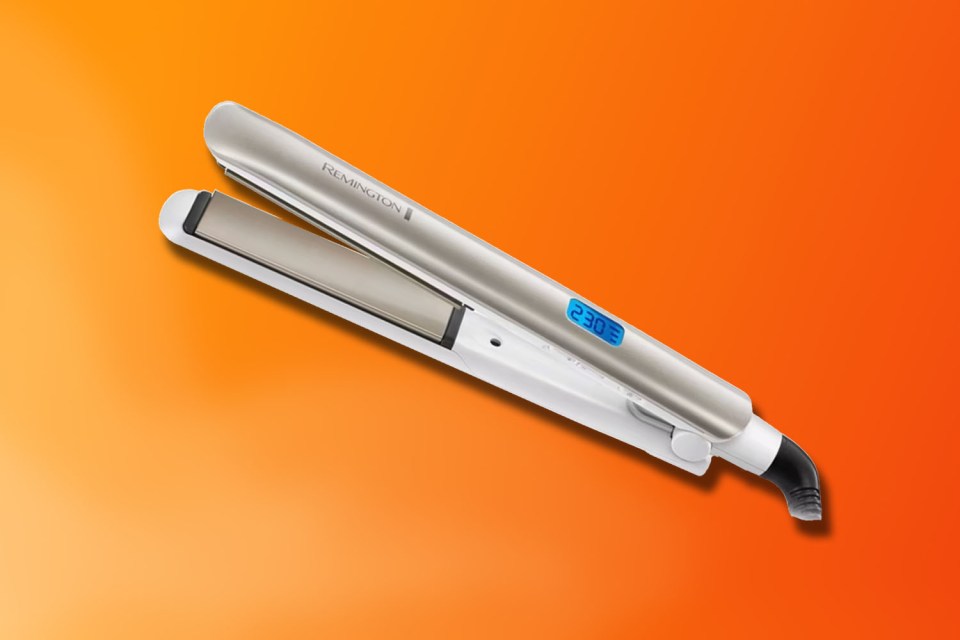 A Remington hair straightener with a digital temperature display showing 230 degrees.
