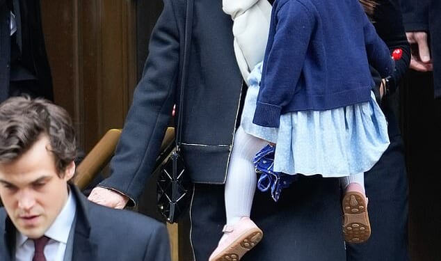 Caroline Kennedy carries her one-year-old granddaughter, Josephine, as she leaves her daughter's funeral earlier this week