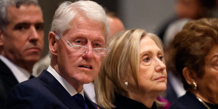 Bill and Hillary Clinton sit and look on at the funeral service of former Labor Secretary Alexis Herman at the National Cathedral on May 14, 2025 in Washington, DC.
