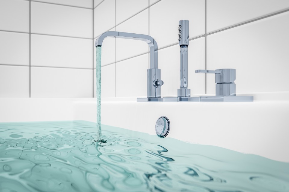 Illustration of a bathtub filling with water from a chrome faucet.