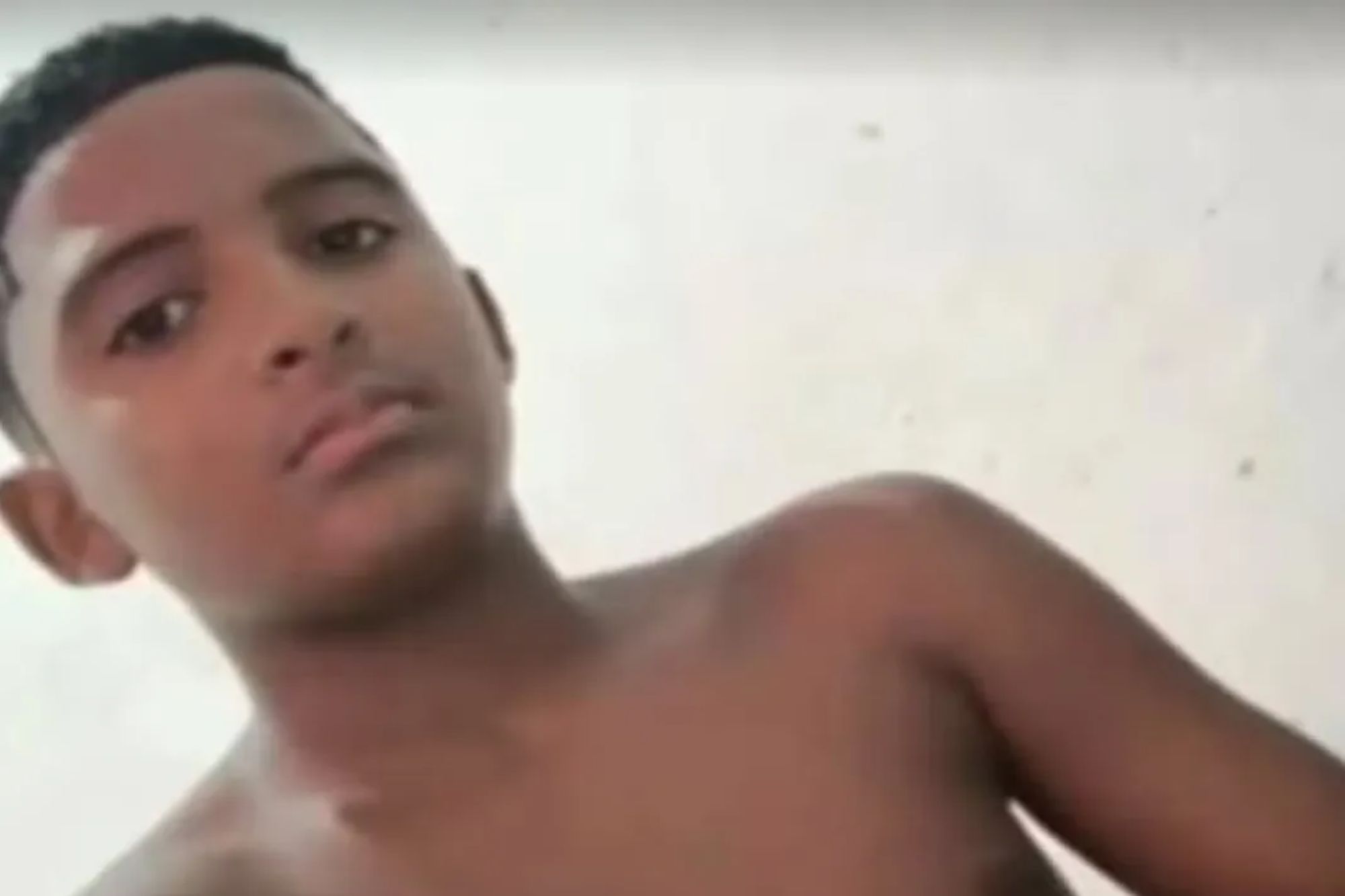 An image collage containing 1 images, Image 1 shows A young boy with short, dark hair and dark eyes looks forward at the camera