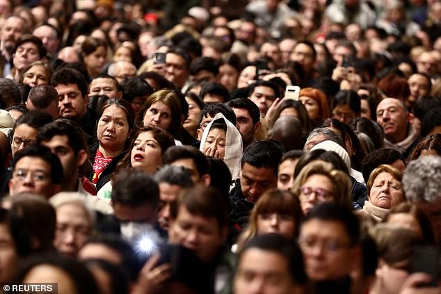 The faithful celebrate Christmas Holy Mass in St. Peter's Basilica at the Vatican where 100 per cent of its citizens are immigrants, the highest in the world