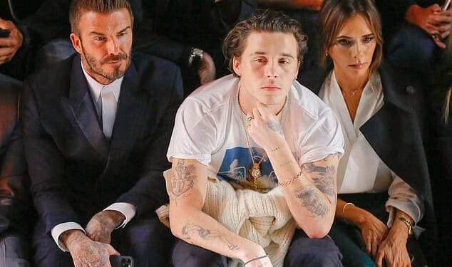 Brooklyn Beckham was once so homesick for his family that he dropped out of his New York photography course after just one year (Seen with mum Victoria and dad David in 2020)