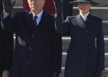 Melania Trump wearing The Hat – the millinery equivalent of a barbed-wire fence – the brim so large it allowed her to repel Donald’s lips when he tried to kiss her