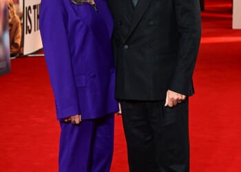 John Bishop looks set for global fame as the subject of Is This Thing On? Bradley Cooper's new film that is loosely inspired by how he saved his marriage to wife Melanie (pictured this week)