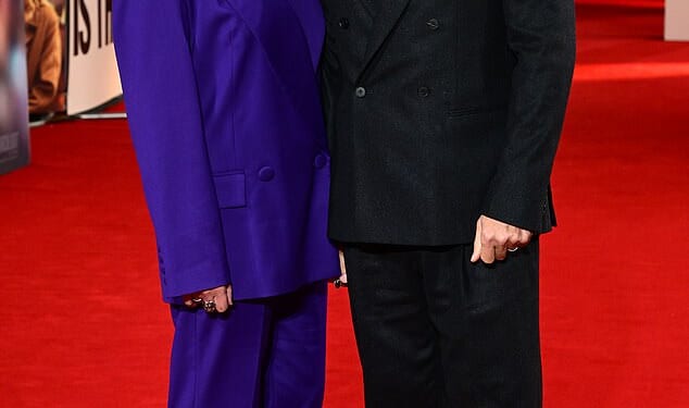 John Bishop looks set for global fame as the subject of Is This Thing On? Bradley Cooper's new film that is loosely inspired by how he saved his marriage to wife Melanie (pictured this week)