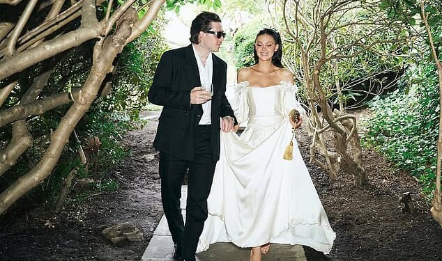 Brooklyn Beckham's claim his mother Victoria pulled out of designing Nicola Peltz's wedding dress at the 'eleventh hour' contradicts what the bride's stylist said (pictured vow renewal)